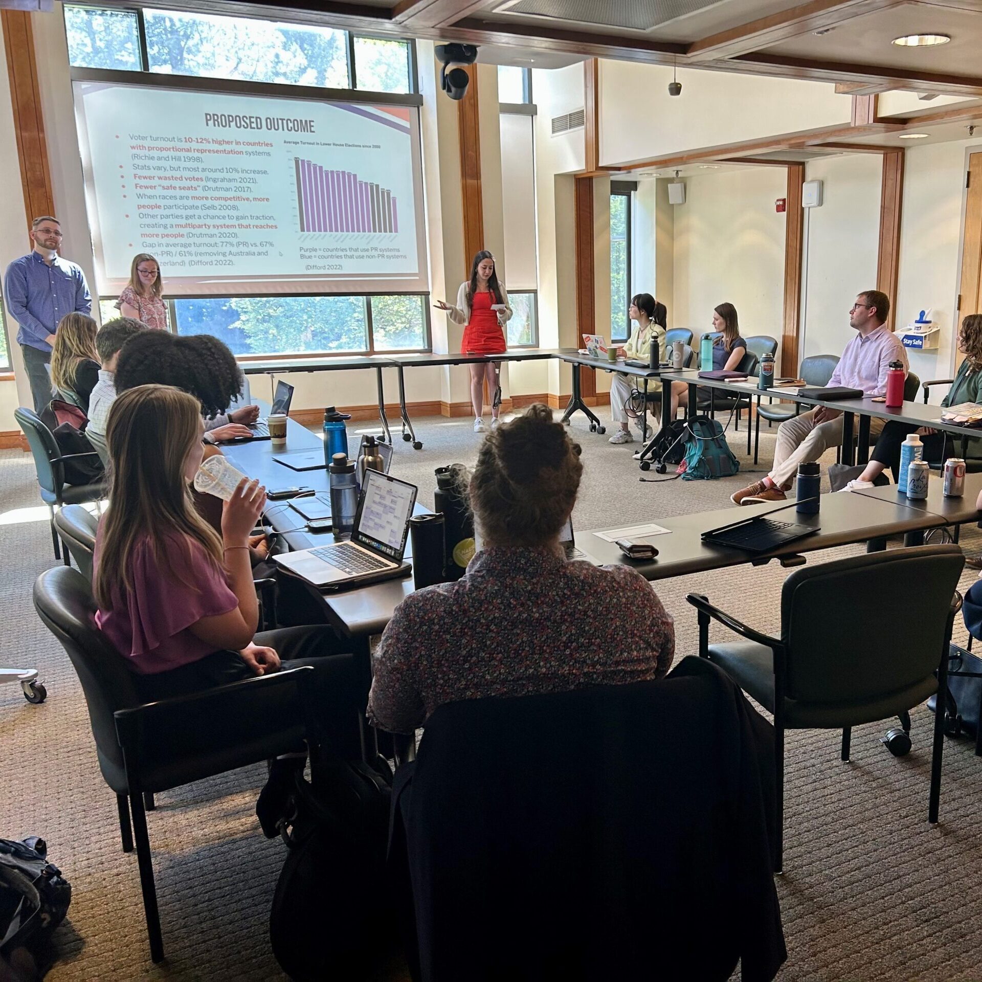 Students presenting proposals for voting and election integrity to Michigan Secretary of State Jocelyn Benson