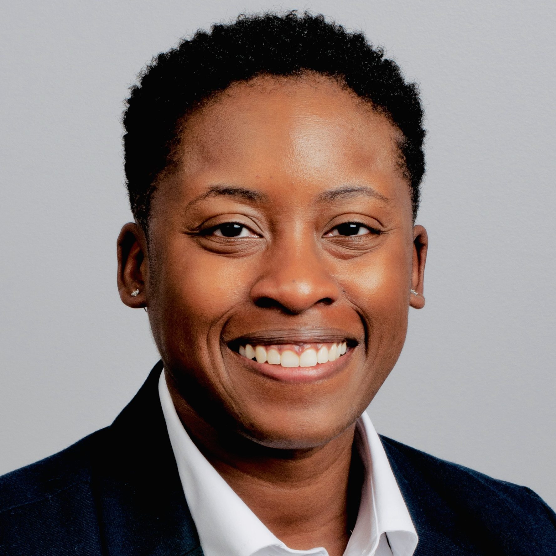 Girl With short hair looking into camera smiling